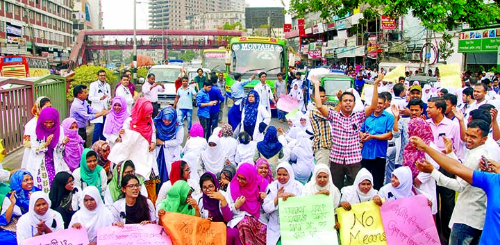 Nurses sit-in strike under the heat of scorching sun on Thursday in city's Kalyanpur area and blocked the road protesting rape and killing of nurse Tania in Kishoreganj.