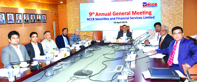 Md. Amirul Islam, Chairman of NCCB Securities and Financial Services Limited, presiding over its 9th AGM at its head office in the city recently. Md. Nurun Newaz Salim, Chairman of NCC Bank Limited was also present.