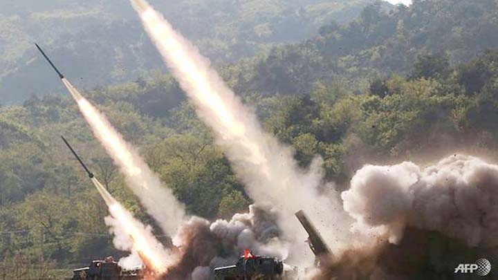 Picture released from North Korea's official Korean Central News Agency (KCNA) on Thursday shows rocket launchers firing during a drill by units of the Korean People's Army .