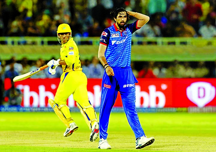 Mahendra Singh Dhoni, captain of Chennai Super Kings, tales a run as Ishant Sharma of Delhi Capitals follows the ball during the cricket eliminator match between Delhi Capitals and Chennai Super Kings in Visakhapatnam, India on Friday.