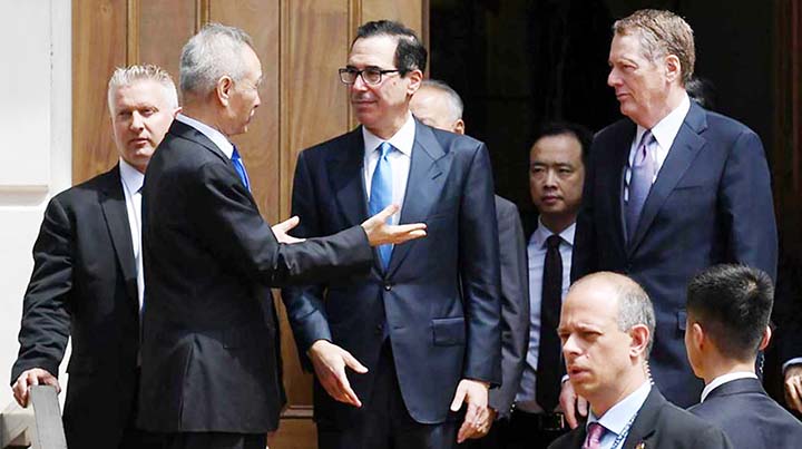 Chinese Vice Premier Liu He talks with US Treasury Secretary Steven Mnuchin and Trade Representative Robert Lighthizer as he leaves trade talks in Washington.