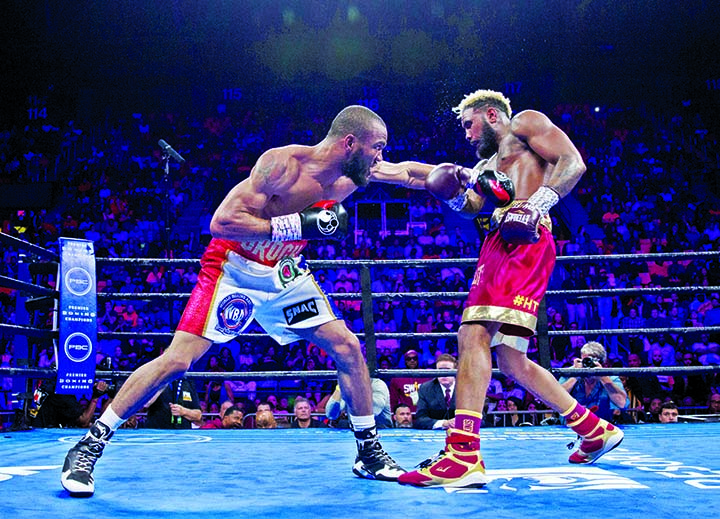 Julian Williams (left) hits Jarrett Hurd during their IBF, WBA and IBO super welterweight title boxing bout in Fairfax, Va on Saturday. Williams won by unanimous decision.