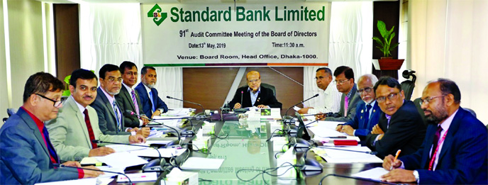 S S Nizamuddin Ahmed, Chairman of Audit Committee of the Board of Directors of Standard Bank Limited, presiding over its 91st meeting at the Bank's head office on Monday. Mamun-Ur-Rashid, Managing Director of the Bank was also present.