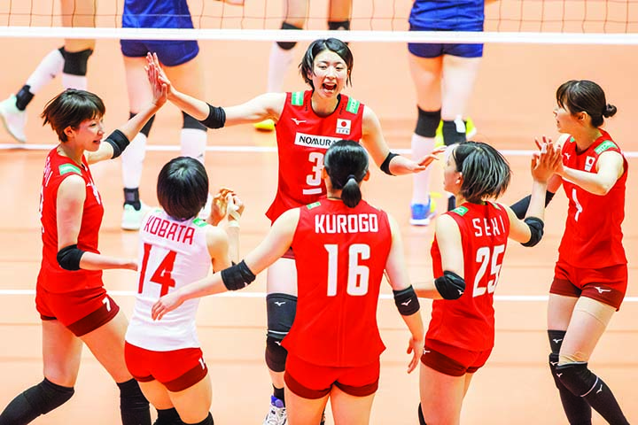 Japan players celebrate a set point during the match between Japan and China, at the Montreux Volleyball Masters women's tournament, in Montreux, Switzerland on Monday.