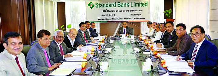 Mohammed Shamsul Alam, Vice-Chairman of Standard Bank Ltd, presiding over its313th Board Meeting at the Bank's head office onTuesday. Directors Kamal Mostafa Chowdhury, Ashok Kumar Saha, Ferozur Rahman, Mohammed Abdul Aziz, Gulzar Ahmed, Md. Zahedul Hoqu