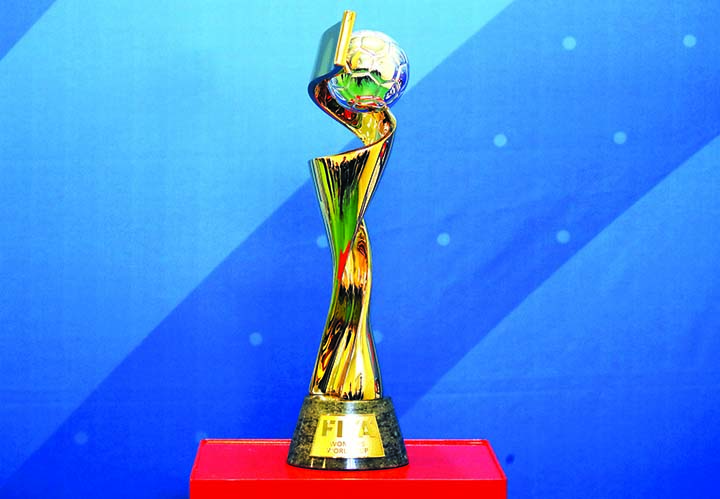 The Women's Soccer World Cup trophy is on display during its presention in a Paris school on Tuesday.