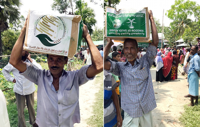Distressed people seen carrying iftar items distributed by King Salman Humanitasian Aid and Relief Centre through International Organization for Relief, Welfare and Development (IORWD) at Swandip Upazila in Chattogram yesterday.