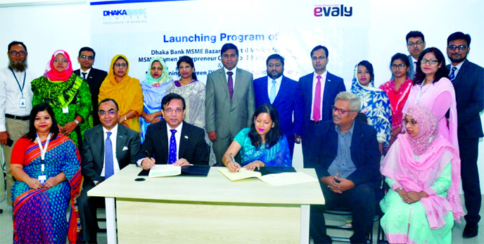 Md. Shakir Amin Chowdhury, Deputy Managing Director of Dhaka Bank and Shamina Nasrin, Chairman, E-Valy, an online e-commerce based shopping platform, sign an agreement at the Bank's corporate office in the city on Wednesday. Under the deal, an individual