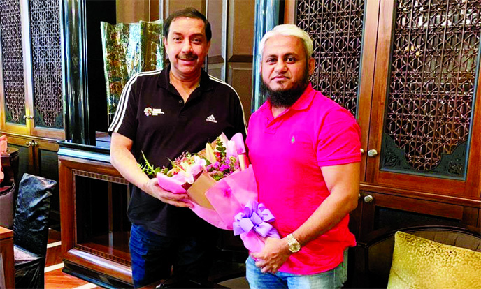 General Secretary of Bangladesh Hockey Federation AKM Mominul Haque Sayeed (right) giving a bouquet to Taiyeb Ikram, Chief Executive Officer of Asian Hockey Federation (AHF), at the Head Office of AHF in Kuala Lumpur, the capital city of Malaysia on Thurs