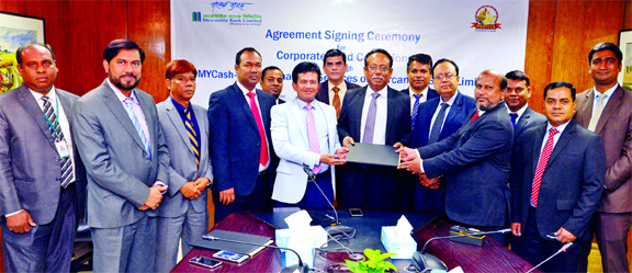 Md. Rafiqul Hoque Bhuiyan, Head of Mobile Banking Division of Mercantile Bank Limited and Md. Nurun Nabi Bhuiyan, Chairman of Provita Group, exchanging an agreement signing document at the Bank's premises recently. Md. Quamrul Islam Chowdhury, Managing D