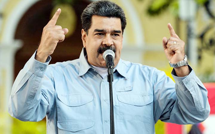 Venezuelan President Nicolas Maduro delivers a speech on the signature campaign launched to urge the United States' to put a halt to intervention threats against his government, at Bolivar square in Caracas.