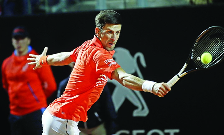 Novak Djokovic of Serbia, returns the ball to Juan Martin Del Potro of Argentina, during their quarterfinal match at the Italian Open tennis tournament in Rome on Friday.