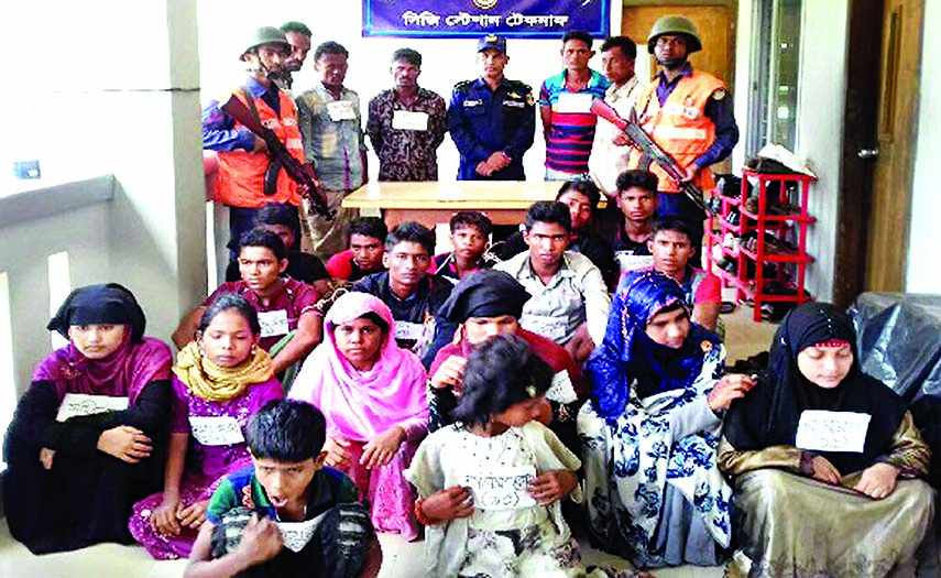 Bangladesh Coast Guard in a continuous drive at Bay 17 more Rohingya refugees were rescued from near the St. Martin's Island while those being trafficked to Malaysia early Saturday. Five traffickers of the gang also seen (top) in the picture.
