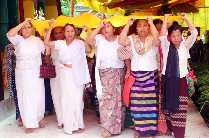 Buddhist women performing rituals at Youngdwa Monastert at Khagrachhari on the occasion of the Buddha Purnima on Saturday.