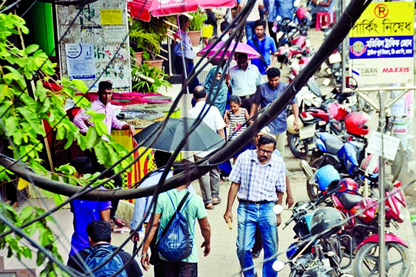 Several motor bikes being kept in long queue ignoring no parking notice, causing sufferings to commuters. This photo was taken from Motijheel area on Sunday.