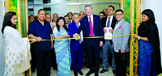 Nasir A. Chowdhury, Advisor and Founding Managing Director of Green Delta Insurance Company (GDIC), inaugurating a new office premises for Professional Advancement Bangladesh Ltd (PABL), a subsidiary of GDIC at Gulshan-1 in the city on Monday. Keith Richa