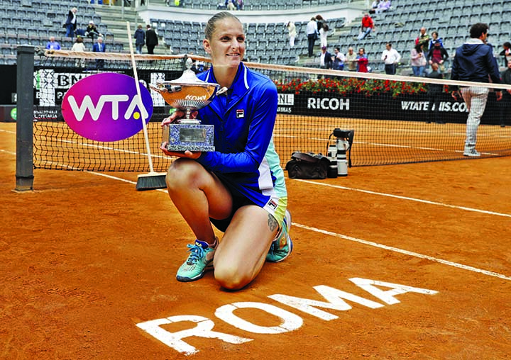 Karolina Pliskova of the Czech Republic holds the trophy after winning the final match against Johanna Konta at the Italian Open tennis tournament in Rome on Sunday. Karolina Pliskova captured the biggest clay-clay-court title of her career by beating Joh