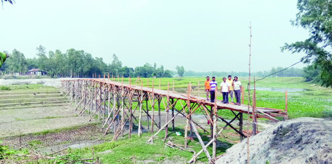 SARISHABARI (Jamalpur ): After three decades of sufferings , people of Satpua Union in Sarishabari Upazila in the district constructed a wooden bridge over a branch of the Jamuna River at their own cost to abate their woes during the monsoon.