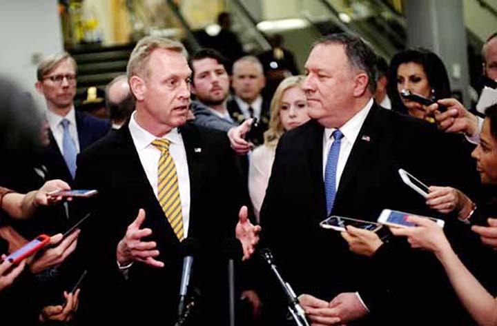 Acting US Defense Secretary Patrick Shanahan (left) and U.S. Secretary of State Mike Pompeo speak to reporters after briefing Senators on Iran in Washington on Tuesday.