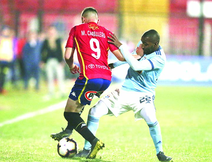 Mauro Caballero of Chile's Union EspaÃ±ola (left) fights for the ball with Jair Cespedes of Peru's Sporting Cristal, during a Copa Sudamericana soccer match in Santiago, Chile on Tuesday.