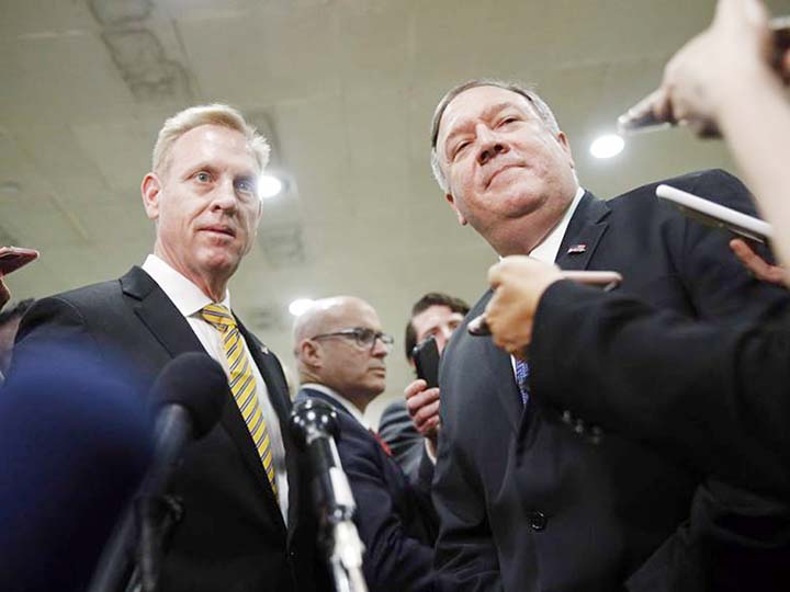 Acting Defense Secretary Patrick Shanahan, left, and Secretary of State Mike Pompeo speak to members of the media after a classified briefing for members of Congress on Iran on Tuesday on Capitol Hill in Washington.