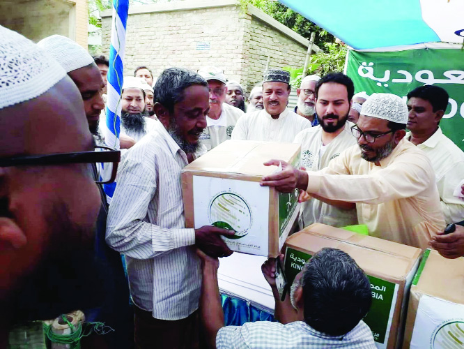 NAOGAON: King Salman Humanatrian Aid and Relief Centre distributing iftar items among underprivileged people through International Organization for Relief, Welfare and Development (IORWD) at Hat Naogan Eidgaon ground in Naogaon yesterday.