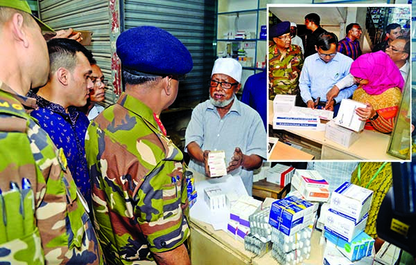RAB mobile team led by a magistrate raided a drug store in city's Mitford area to detect fake and unauthorised medicines on Thursday. Two persons were sent to jail and fined Taka 14 crore for those marketing illegally.