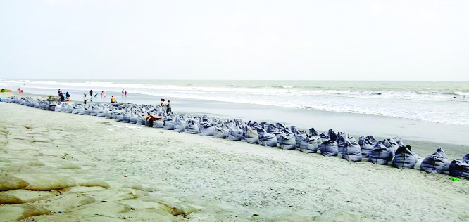 KUAKATA (Patuakhali): The expremental protection work of Kuakata Sea Beach has started from Zero Point to Dakhil Madrasa point . This snap was takan on Friday.