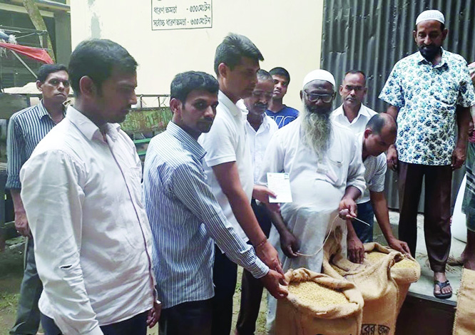 MIRZAPUR(Tangail): Officials of Food Department procuring paddy from farmers at Mirzapur Upazila on Thursday.