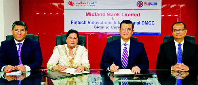 Md. Ahsan-uz-Zaman, Managing Director of Midland Bank and Azizunnessa Huq, Executive Director of Fintech Innovations International DMCC, a UAE based organization, sign an agreement at the Bank's head office in the city on Thursday. Under the deal, the Ba