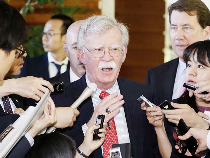 U.S. National Security Adviser John Bolton is surrounded by reporters at the Prime Minister's official residence in Tokyo.