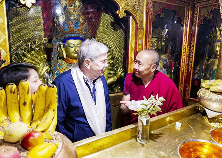 US Embassy in Beijing, U.S. Ambassador to China Terry Branstad, left, speaks with a monk at the Jokhang Temple in Lhasa in western China's Tibet Autonomous Region.