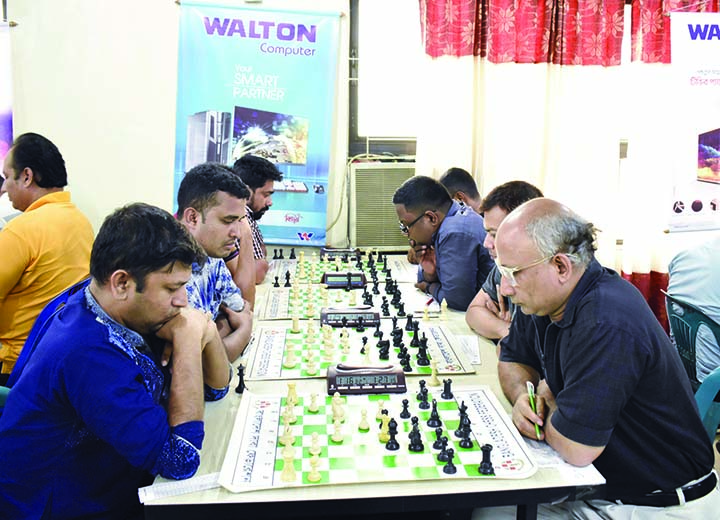 A scene from the fifth round matches of the Walton International Rating Chess Competition at Bangladesh Chess Federation hall-room on Saturday.