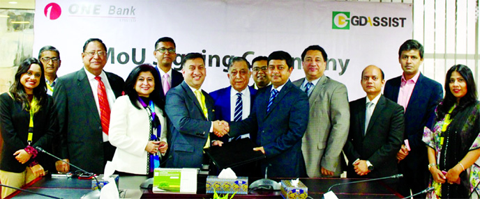 Md. Kamruzzaman, Head of Retail Banking of One Bank Ltd and Syed Moinuddin Ahmed, Managing Director of GD Assist, exchanging an agreement signing document at a city hotel. Farzanah Chowdhury, MD of Green Delta Insurance and Nasir A. Choudhury, Advisor of