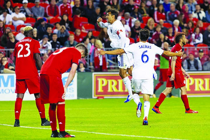 San Jose Earthquakes' Chris Wondolowski (center) celebrates after scoring a goal during the second half of an MLS soccer game against Toronto FC, in Toronto on Sunday.