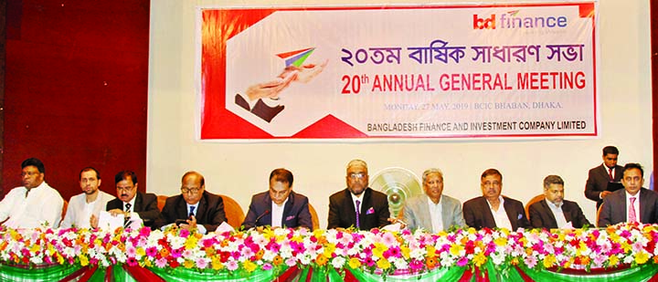 Manwar Hossain, Chairman of BD Finance, presiding over its 20th annual general meeting at BCIC auditorium, Dhaka on Monday. Vice-Chairman Khondker Fazle Rashid, Directors Golam Hafiz Ahmed, Geasuddin Ahmed, Ansar Uddin Ahmed, Md Abul Quasem, Yousuf Aman,