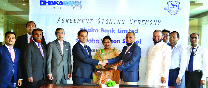 Md Shafquat Hossain, Head of Retail Business Division of Dhaka Bank Ltd (DBL) and Malik Talha Ismail Bari, Director of United Professional Services Ltd, exchanging an agreement signing document at the corporate office of the United Group in the city on Su