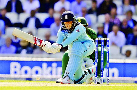 England's Joe Root plays a shot off the bowling of South Africa's Imran Tahir during the opening match of the ICC Cricket World Cup at the Oval in London on Thursday. Joe Root notched up a fine 51, which helped England to score 311 for the loss of eight