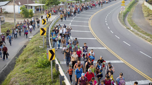 Central American migrants, part of a caravan hoping to reach the U.S. border, walk in Frontera Hidalgo, Mexico.