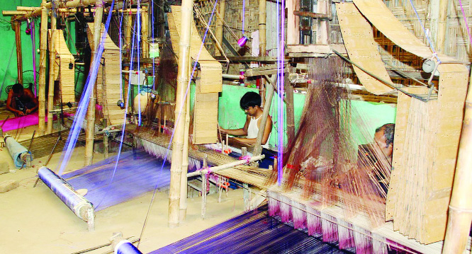 RANGPUR: Weavers passing busy time at Benarashi Palli under Gangachara Upazila in Rangpur. This picture was taken yesterday.