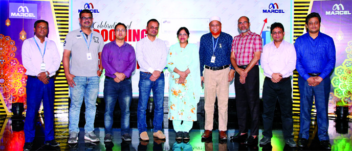 Marcel's high officials pose for a photograph while attending the programme titled "Celebration of Booming sales of Marcel AC"" held at the company's Corporate Office in the capital on Monday."