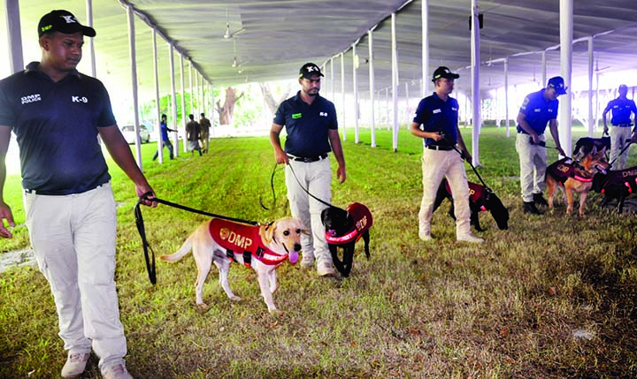 Dhaka Metropolitan Police (DMP) scanning the National Eidgah ground with dog squad for security reason on the occasion of Eid congregation. The snap was taken on Monday