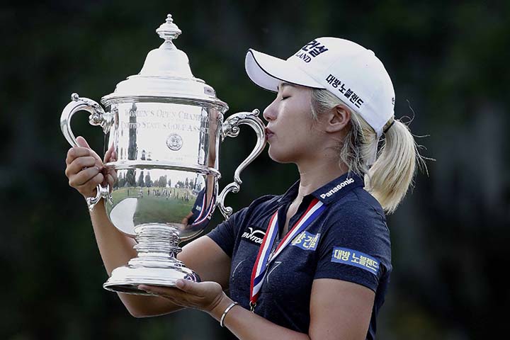 Jeongeun Lee6 of South Korea, kisses the championship trophy after winning the final round of the U.S. Women's Open golf tournament on Sunday.