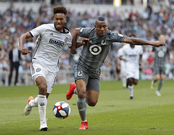 Philadelphia Union defender Auston Trusty (left) and Minnesota United forward Angelo Rodriguez battle for the ball during the second half of an MLS soccer match in St. Paul, Minn on Sunday.
