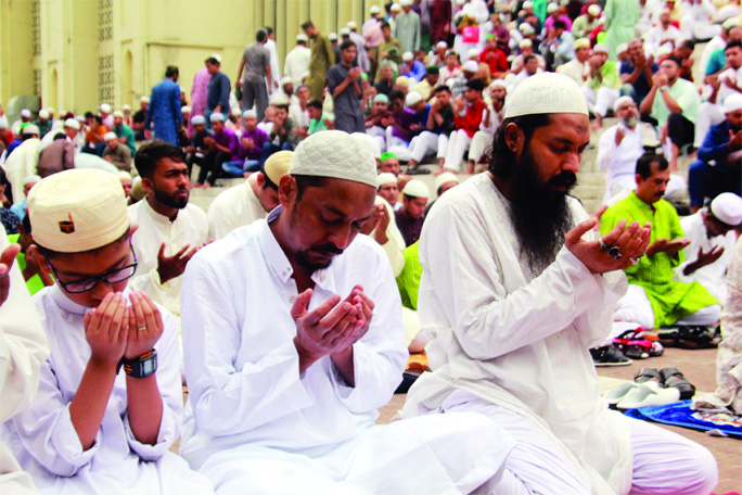Musallies offering munajat after Eid-ul-Fitr prayers. The snap was taken from the city's Baitul Mokarram National Mosque on Wednesday.