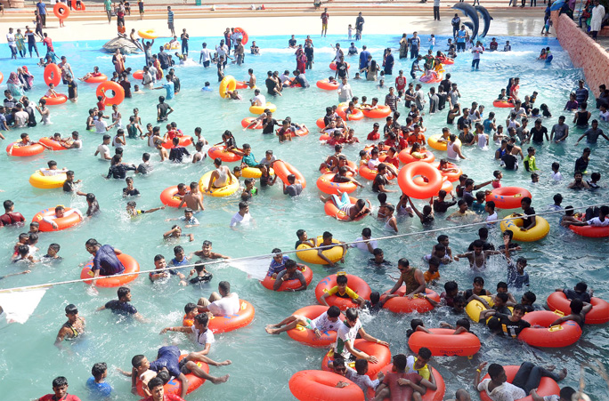 Children enjoying Eid holidays at Foy's Lake Sea World in the Port City yesterday.