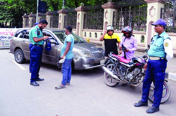 Law enforcers at check-posts set up in different areas of the city for security measures. The snap was taken from the city's Motijheel area on Saturday.