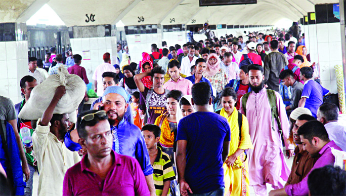 Hundreds of home-goers returning to the capital by trains on the second day after celebrating Eid-ul-Fitr with their near and dear ones as the offices resume today (Sunday). This photo was taken from Kamalapur Railway Station.