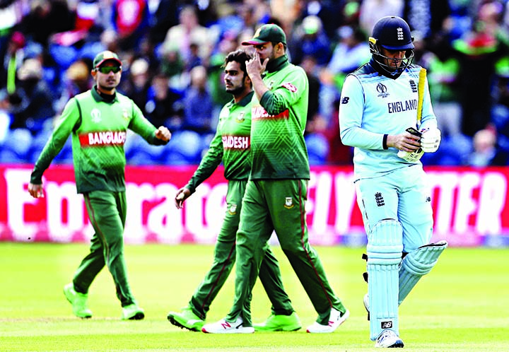 England's Jason Roy (right) reacts after being caught out by Bangladesh's Mashrafe Bin Mortaza during the ICC World Cup Cricket match between England and Bangladesh at the Cardiff Wales Stadium in Wales on Saturday.