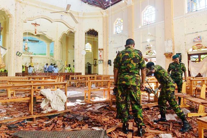 Security personnel inspecting the interior of St Sebastian's Church in Negombo after it was hit by a bomb blast. AP file photo